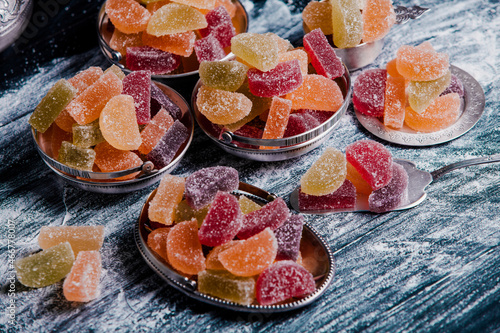 Dessert marmalade in the form of lemon and orange slices. The sweetness of jelly candy.