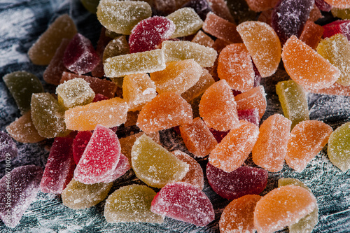 Dessert marmalade in the form of lemon and orange slices. The sweetness of jelly candy.