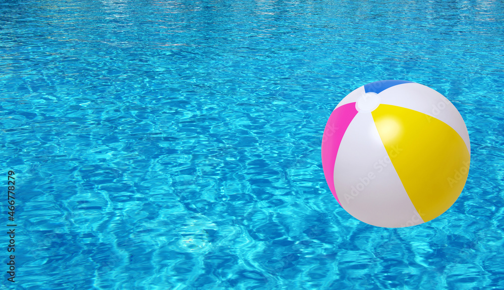 Swimming pool water and beach ball