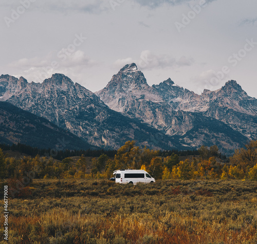 white camper van parked in front of mountains