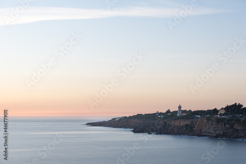Obraz na plátne Farol da Guia on Cascais coastline at sunset