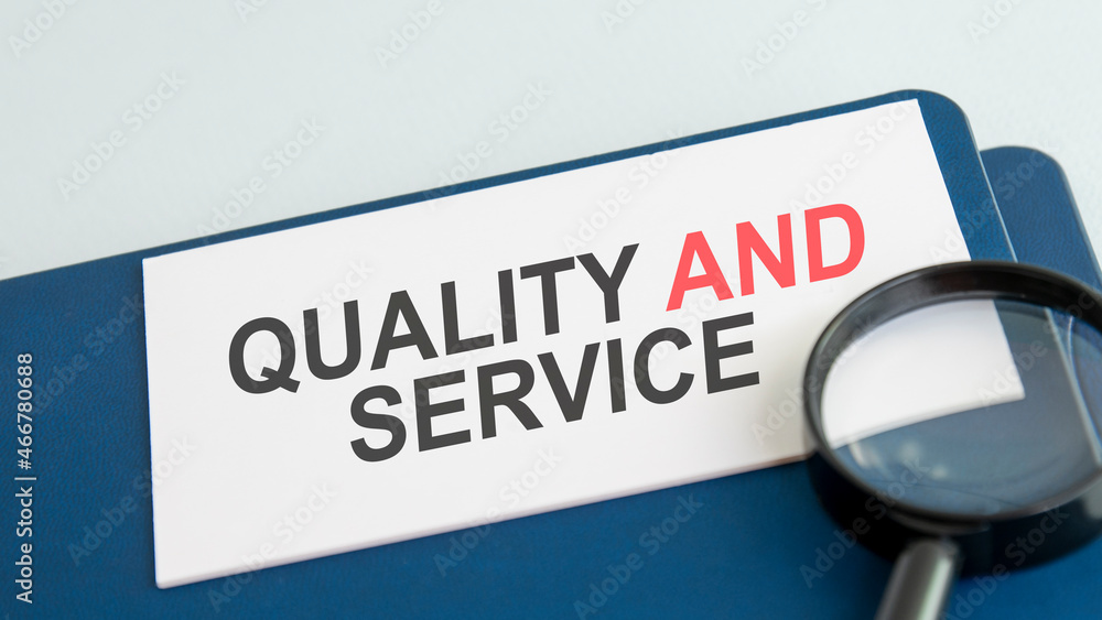 quality and service word on paper and magnifying lens quality and service word on paper and magnifying lens