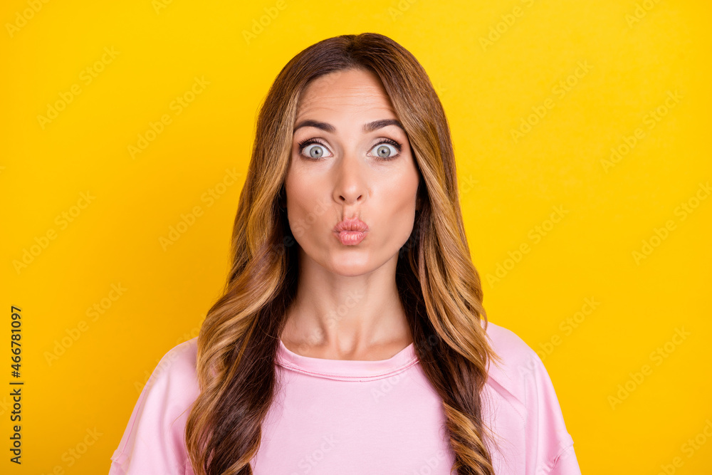 Photo of young attractive woman pouted lips send air kiss flirty romantic isolated over yellow color background Photo of young attractive woman pouted lips send air kiss flirty romantic isolated over yellow color background