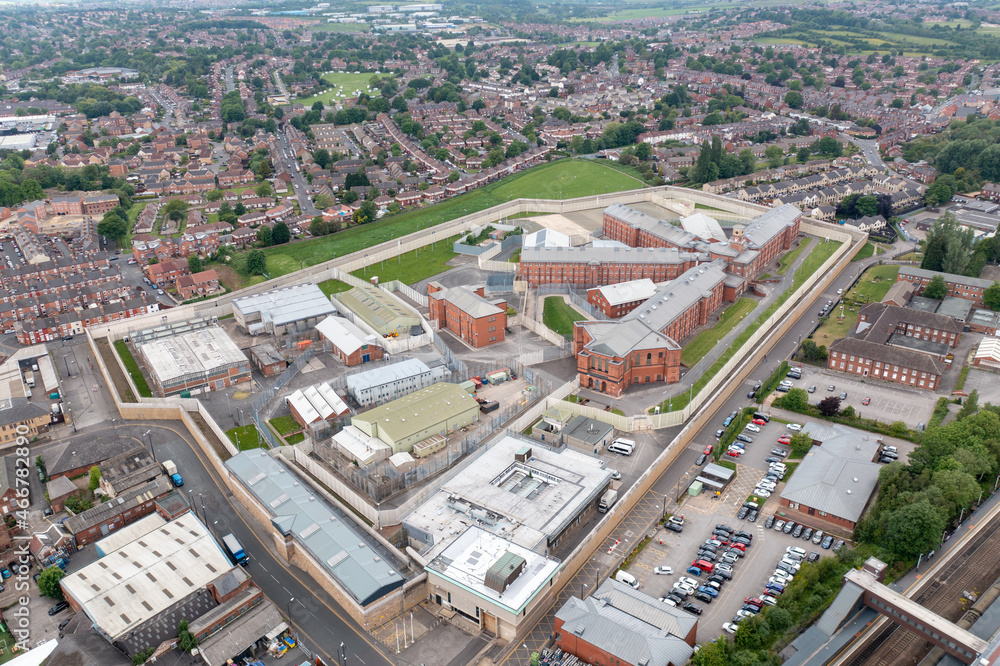 Aerial drone footage of the town centre of Wakefield in West Yorkshire in the UK showing the main building and walls of Her Majesty's Prison