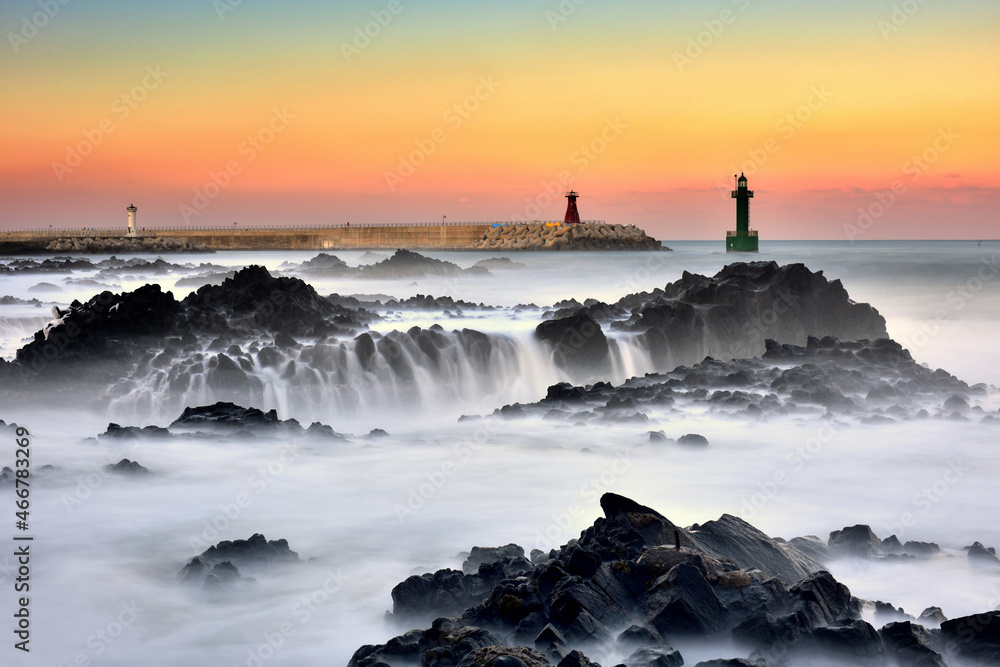 Beautiful scenery of the port with lighthouse, green softness with long exposure