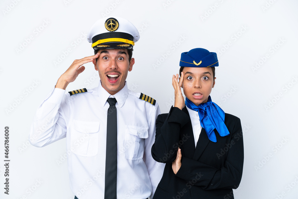 Airplane pilot and mixed race air hostess isolated on white background has just realized something and has intending the solution Airplane pilot and mixed race air hostess isolated on white background has just realized something and has intending the solution