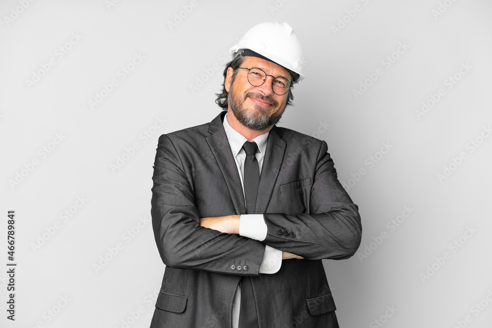 Young architect man with helmet over isolated background keeping the arms crossed in frontal position Young architect man with helmet over isolated background keeping the arms crossed in frontal position