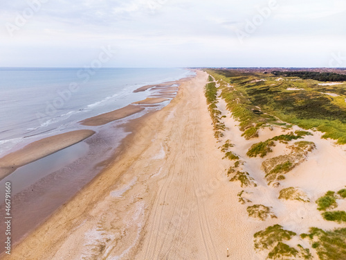 Aerial view of dunes Hollands Duin and North Sea during low tide, Wassenaarse Slag, Wassenaar, Netherlands. photo