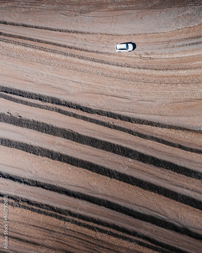 Aerial view of a vehicle driving along the beach near Chirkey, Republic of Dagestan, Russia. photo