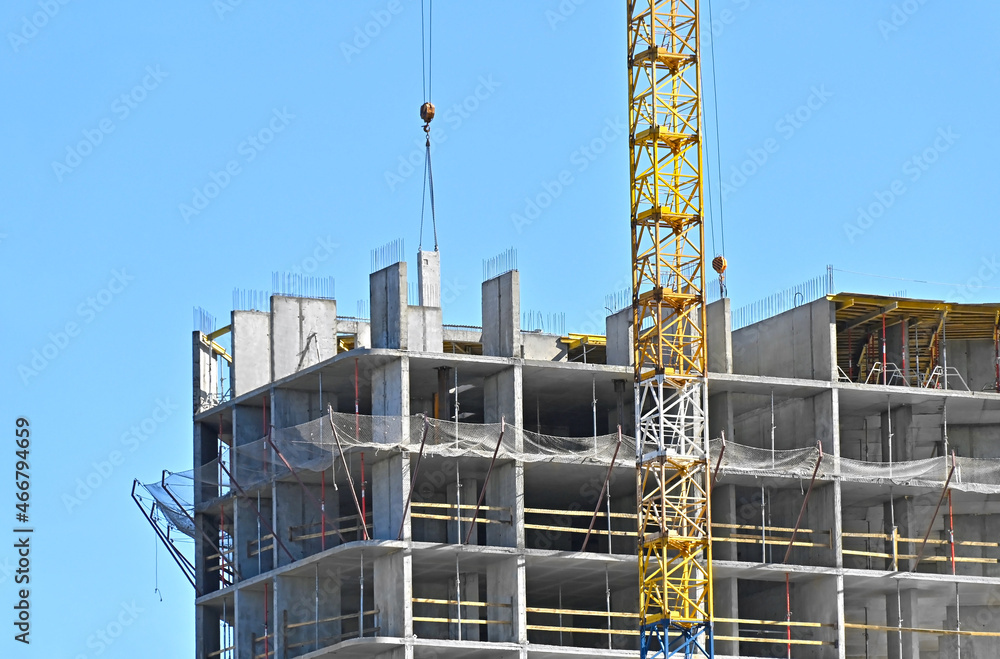 Crane and highrise construction site Crane and highrise construction site