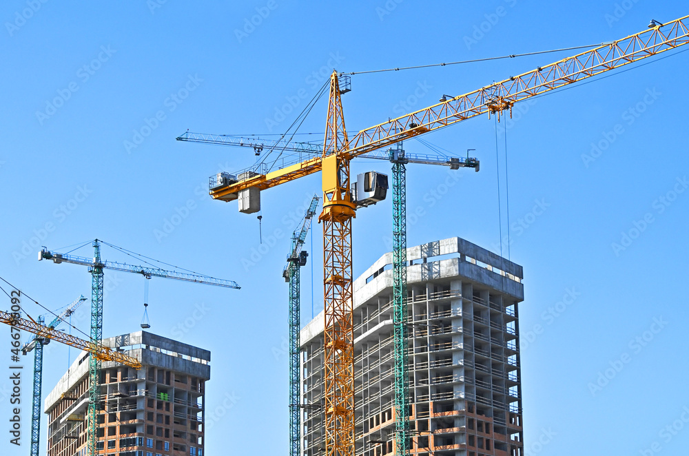 Crane and highrise construction site Crane and highrise construction site