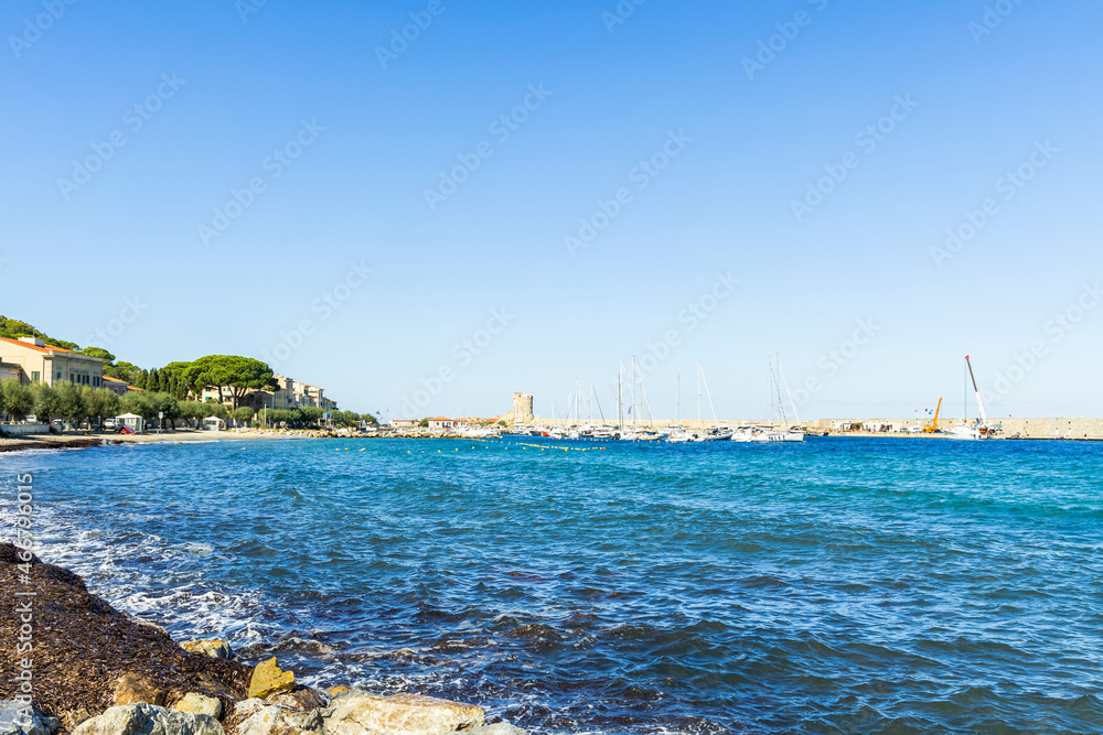 View over the beach and houses and hills of Marciana Marina on the coast of the island of Elba