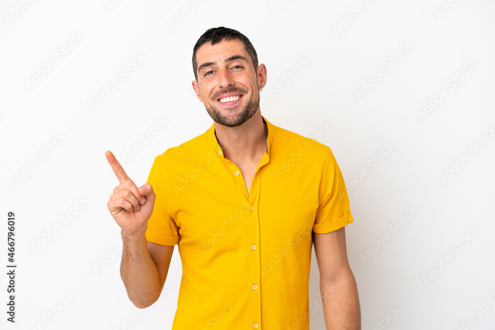 Young handsome caucasian man isolated on white background showing and lifting a finger in sign of the best Young handsome caucasian man isolated on white background showing and lifting a finger in sign of the best
