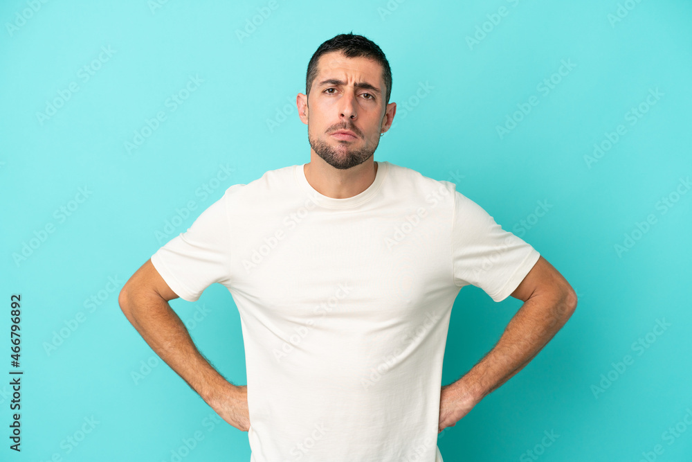 Young handsome caucasian man isolated on blue background angry Young handsome caucasian man isolated on blue background angry