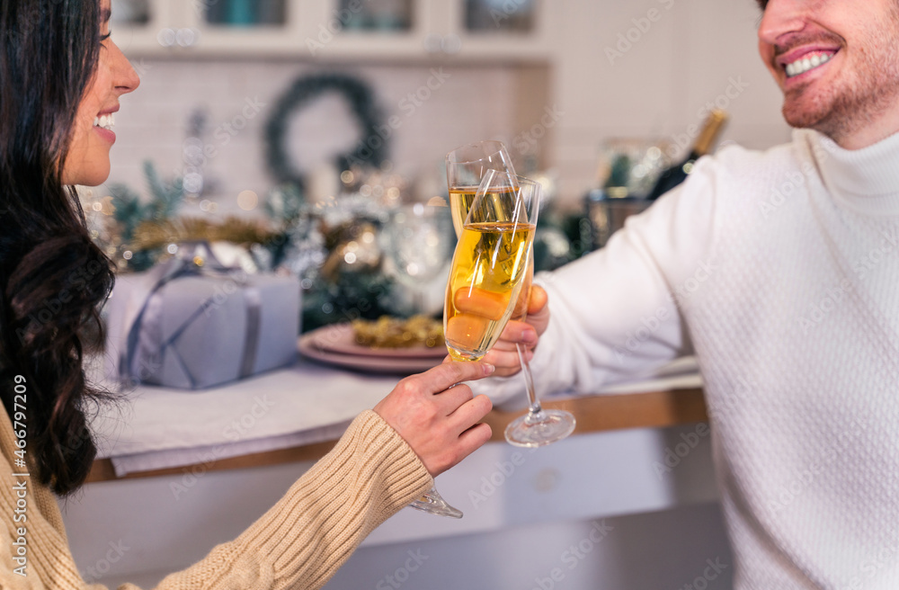 Happy couple celebrating Christmas at home Happy couple celebrating Christmas at home