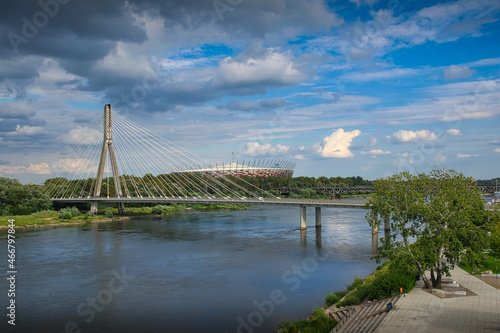 Warsaw - view of the Vistula river. In the background the Swietokrzyski Bridge and PGE Narodowy Stadium photo