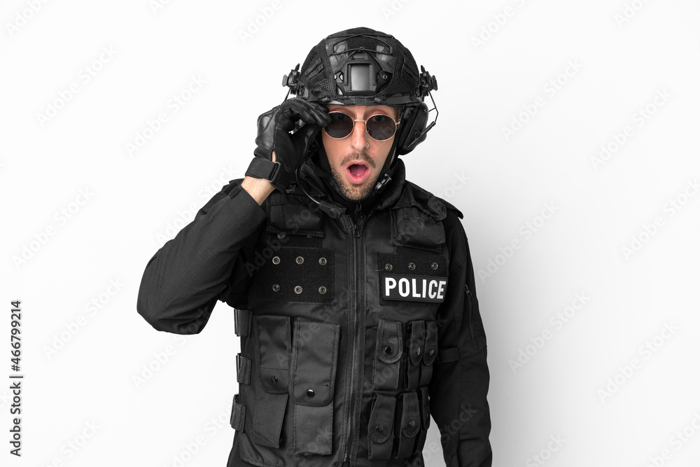 SWAT caucasian man isolated on white background with glasses and surprised SWAT caucasian man isolated on white background with glasses and surprised