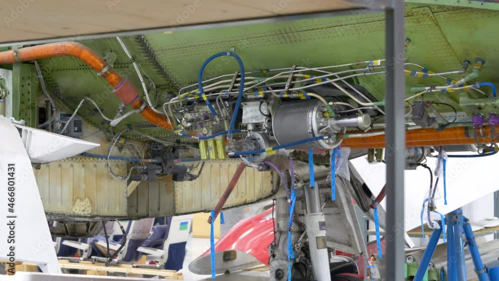 Close up detailed view of an airplane hydraulic system during maintenance Close up detailed view of an airplane hydraulic system during maintenance