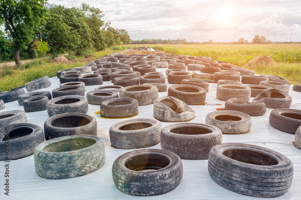 Lots of old used car tires close up on white background Lots of old used car tires close up on white background