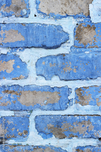 old brick wall with smudges of paint