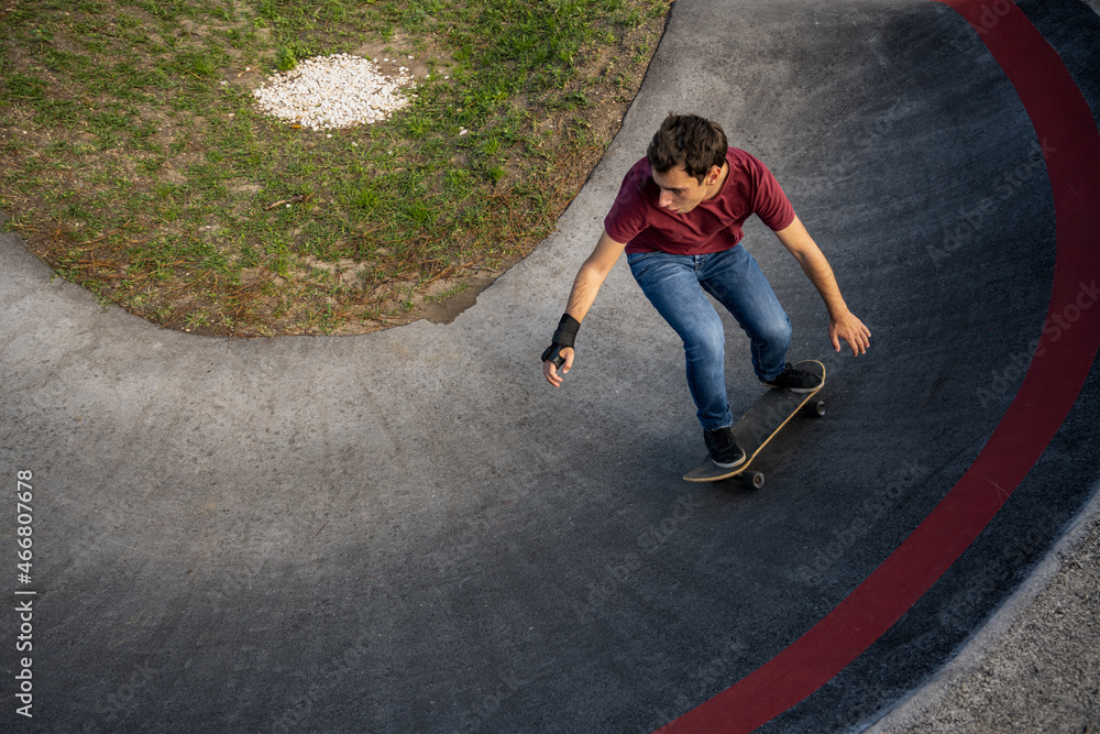 Fototapeta premium Skateboarder practice on a pump track park