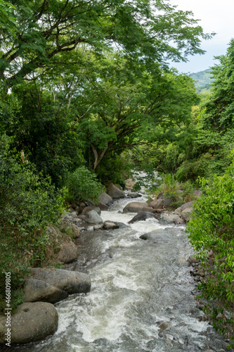 Natural landscape with Cartama river and mountains. Tamesis, Antioquia, Colombia.