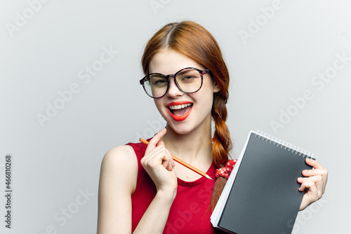 Business woman in red dress notebook pencil professionals