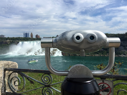 Coin operated binoculars at Niagara Falls, Ontario, Canada. Concept of facial pareidolia or seeing faces. photo