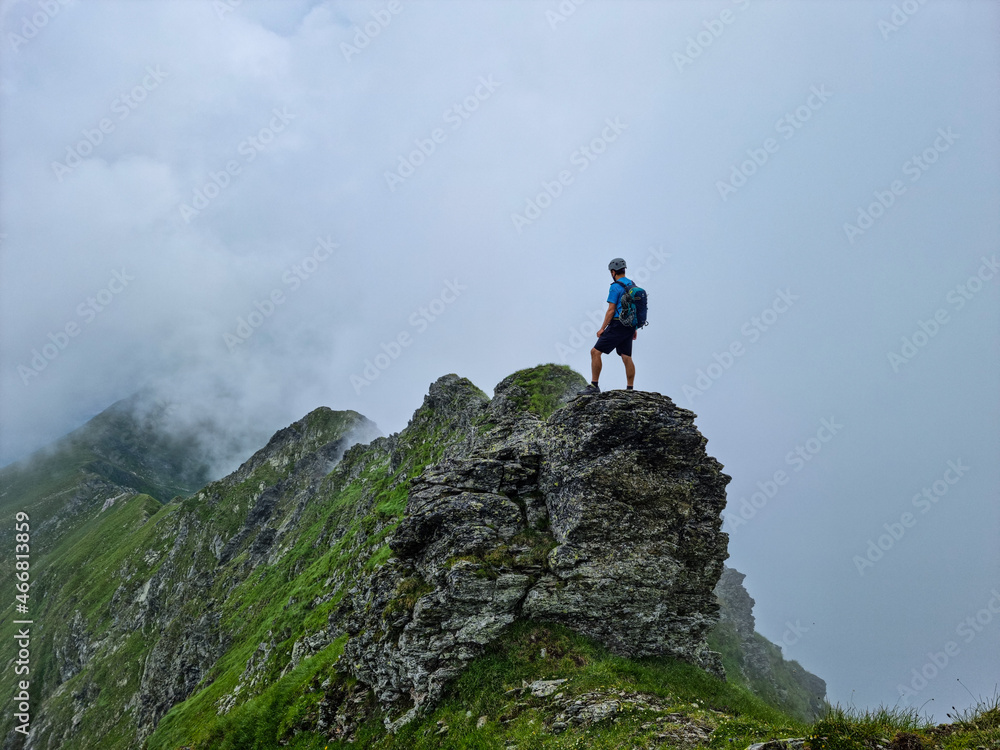 person on the top of a mountain,  Netedu Ridge, Fagaras Mountains, Romania 
