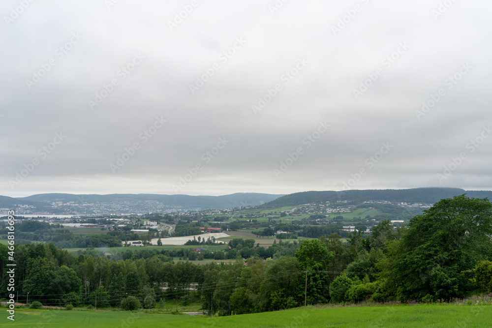 Fototapeta premium Beautiful landscape of the Drammen city with river and the mountains in Norway.