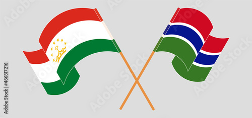 Crossed flags of Tajikistan and the Gambia. Official colors. Correct proportion