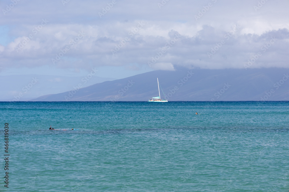 Sailboat in the open sea. Calm sea sailing, luxury summer adventure, active vacations. Maui, Hawaii