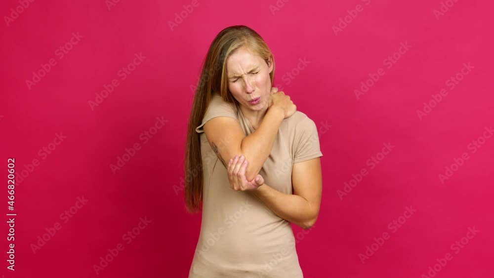 Young blonde girl with shoulder pain over isolated background Young blonde girl with shoulder pain over isolated background
