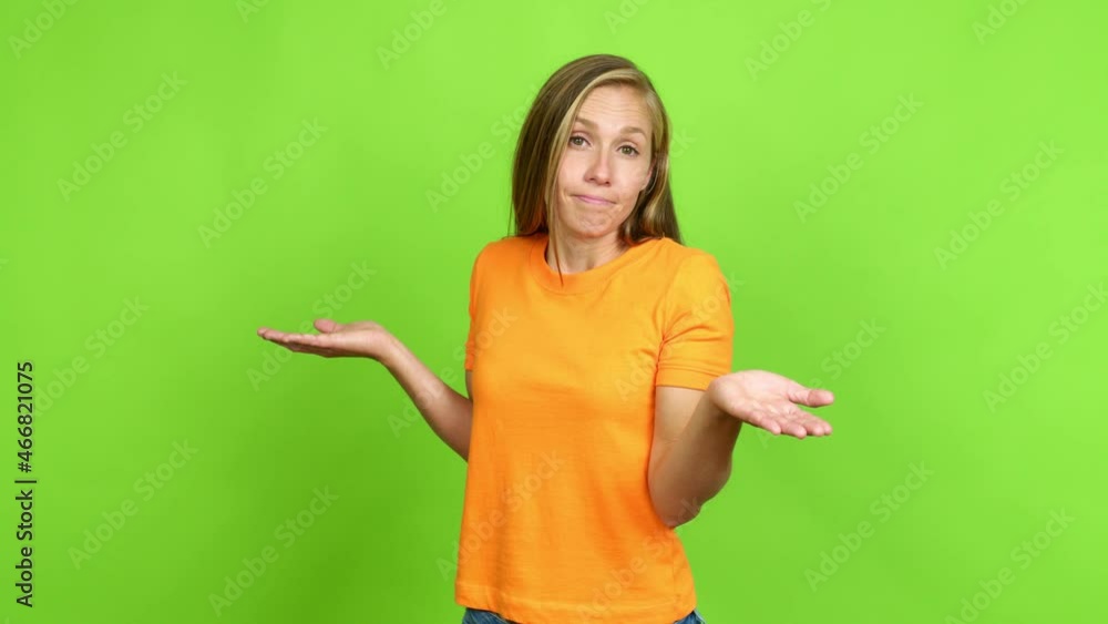 Young blonde girl having doubts over isolated background. Green screen chroma key Young blonde girl having doubts over isolated background. Green screen chroma key