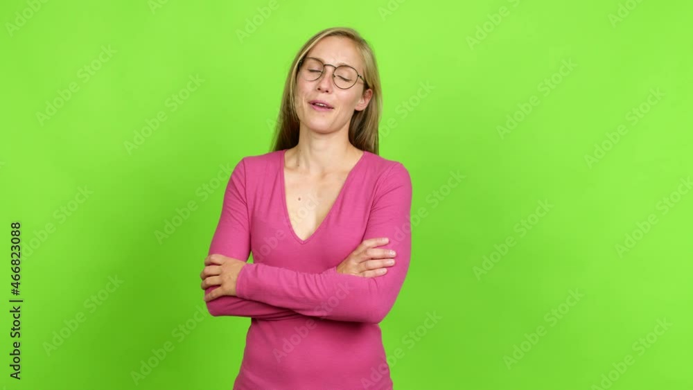 Young blonde girl with glasses over isolated background. Green screen chroma key Young blonde girl with glasses over isolated background. Green screen chroma key