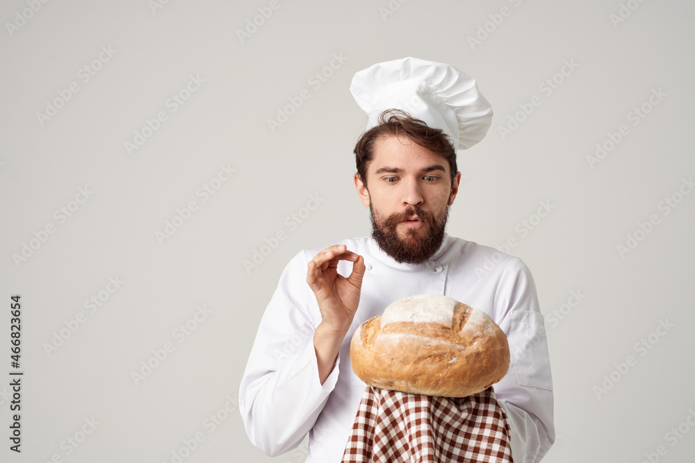 male cook with bread in hand Professional emotions male cook with bread in hand Professional emotions