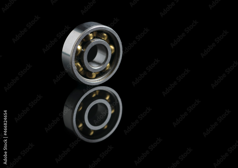 bearing on black reflective base. Copy space bearing on black reflective base. Copy space