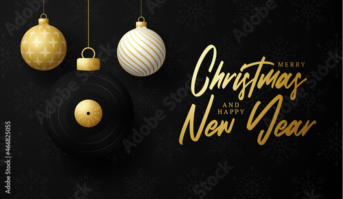 musical vinyl record Christmas card. Merry Christmas music greeting card. Hang on a thread vinyl record as a xmas ball and golden bauble on black background. musical Vector illustration.