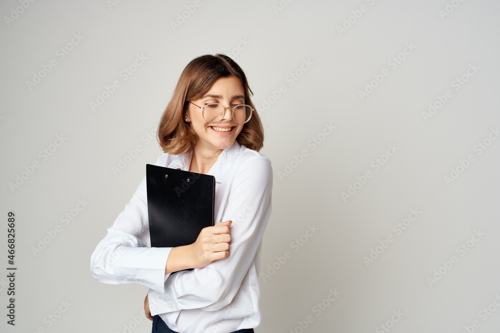 Businesswoman with documents in hand work light background Businesswoman with documents in hand work light background
