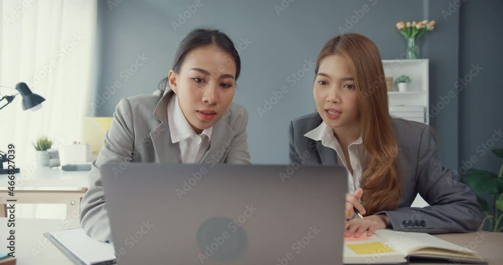 Group of young asia creative team discuss project compare point in paperwork and laptop on table working and communicating together on office desk at workplace. Partner cooperation, coworker teamwork. Group of young asia creative team discuss project compare point in paperwork and laptop on table working and communicating together on office desk at workplace. Partner cooperation, coworker teamwork.