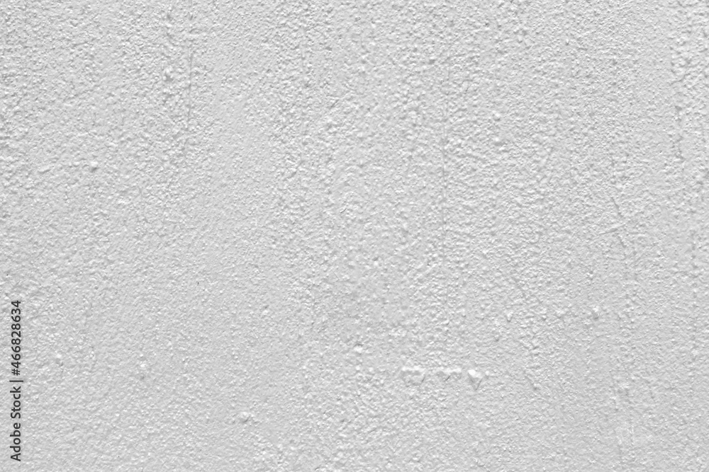 The wall of the cement building is painted white texture and background seamless The wall of the cement building is painted white texture and background seamless