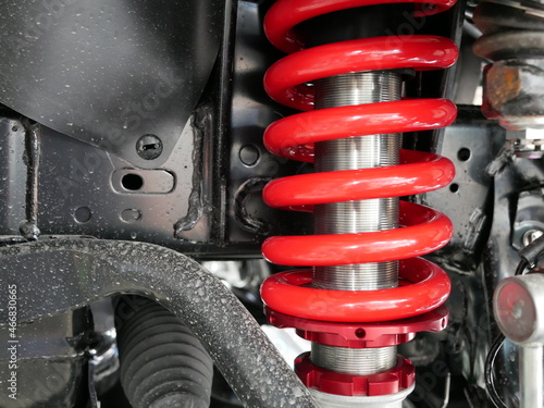 red shock absorbers of car at garage.