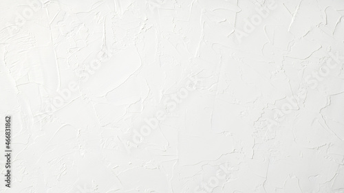表面に凹凸のある白い壁の背景テクスチャー
