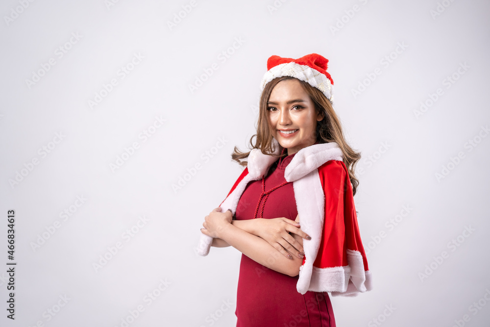 Happy Christmas woman in Santa hat smiling on white background,Positive human emotions facial expressions,Winter holidays and people concept. Happy Christmas woman in Santa hat smiling on white background,Positive human emotions facial expressions,Winter holidays and people concept.