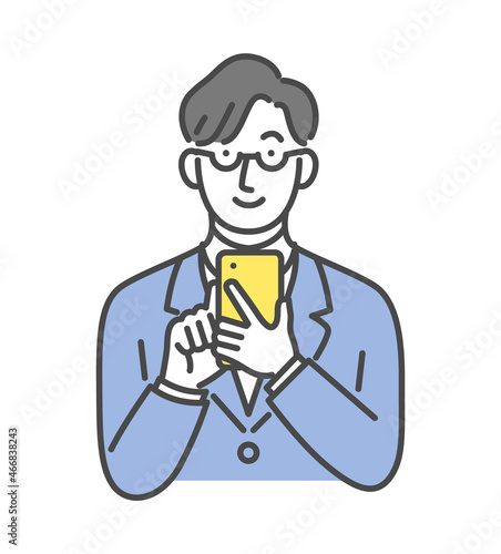 スマホを操作するスーツ男性