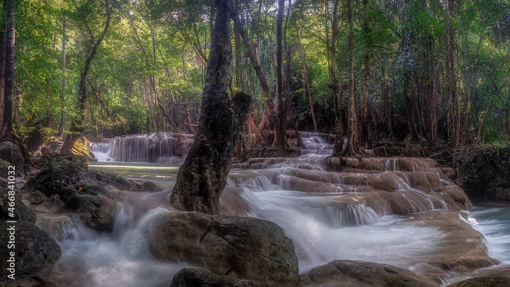 Erawan Waterfall at Kanchanaburi in Thailand. It has the perfection of forests of various species in nature. A lot of water flows down through the layers of limestone in rainy season.