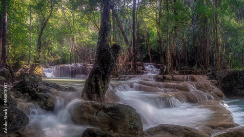 Erawan Waterfall at Kanchanaburi in Thailand. It has the perfection of forests of various species in nature. A lot of water flows down through the layers of limestone in rainy season.