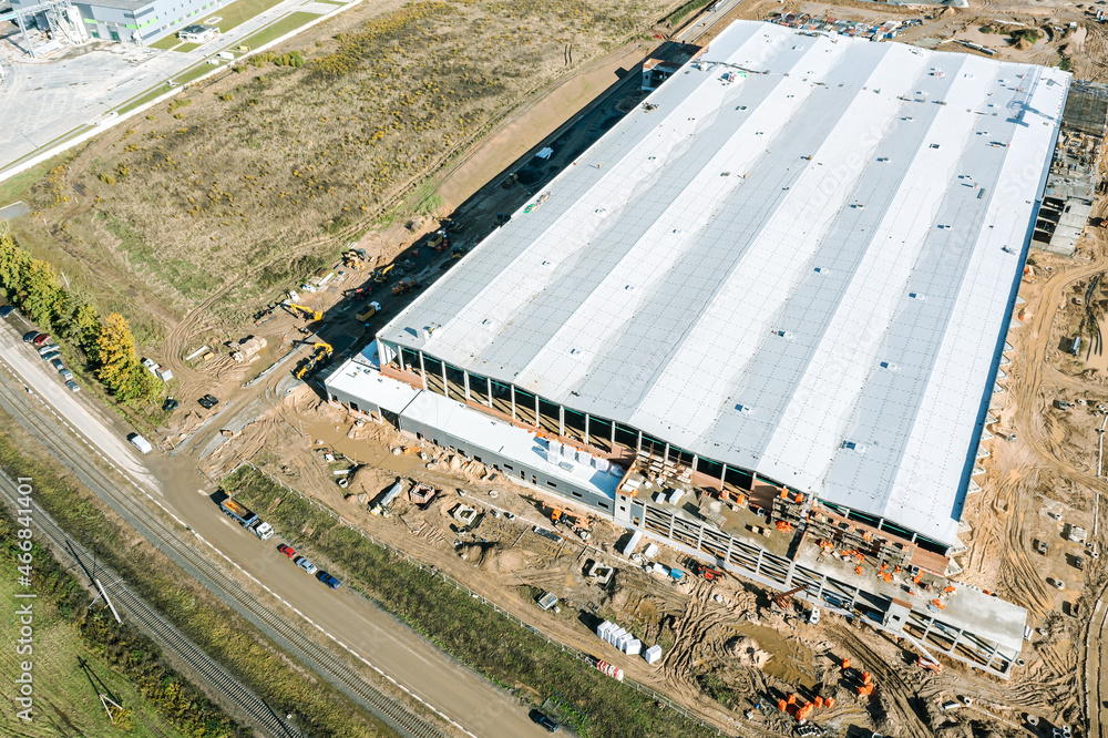 aerial view of large construction site. industrial building, warehouse or logistic center under construction