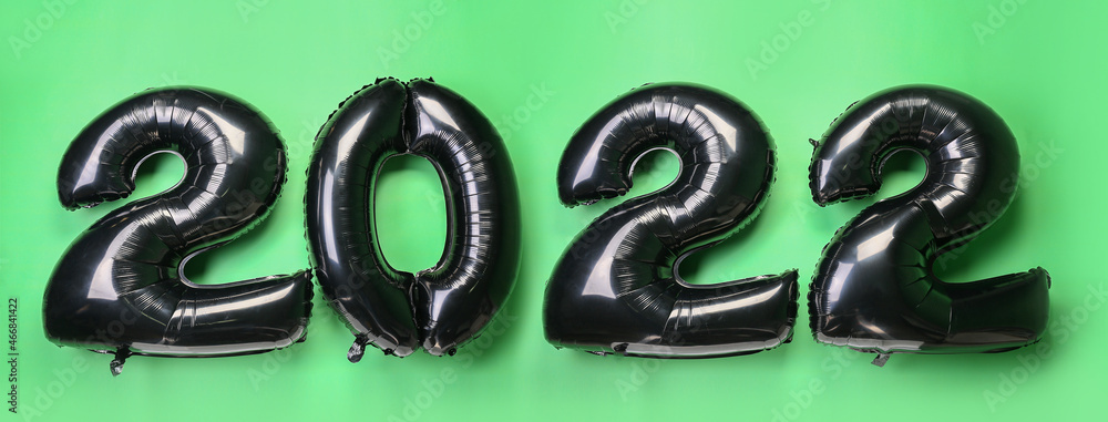 Figure 2022 made of balloons on color background Figure 2022 made of balloons on color background