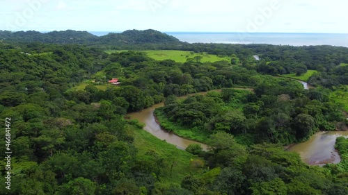 Sea and river beautiful landcape. Outdoor adventure . Pacific sea . Water texture. Cinematic wild nature aerial 4K,Costa Rica beach. 4K.Untouched nature on sunny summer day